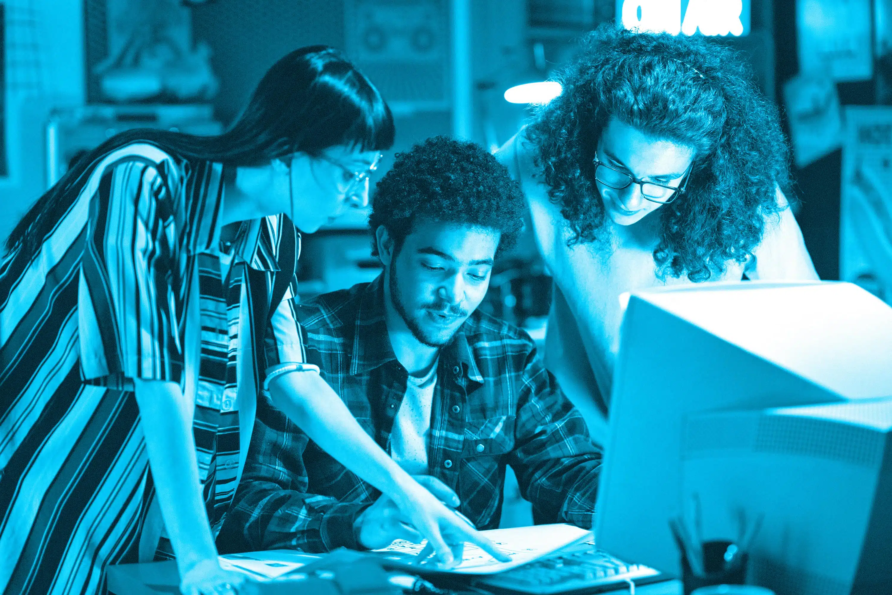 group-of-young-startups-discussing-blueprint